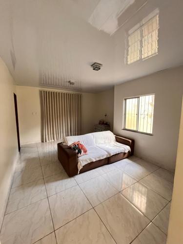 En eller flere senge i et værelse på Casa Almeida - sinta em casa na Cop 30