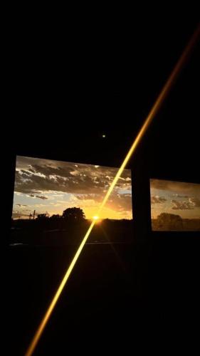 a view of the sunset from the window of a car at Condominio Atuel con Cocina Wifi Cochera Desayuno in San Rafael