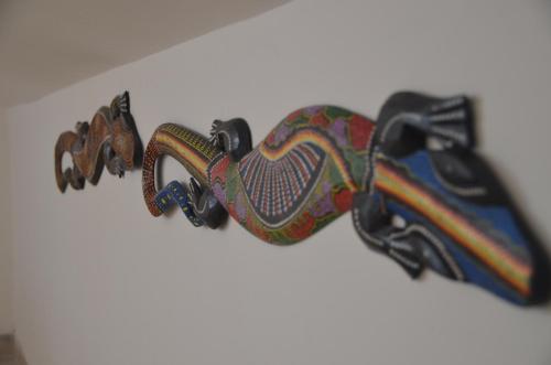 a pair of shoes hanging on a wall at Taormina Bay Lucia's House 3 in Nizza di Sicilia