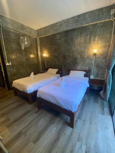 Postel nebo postele na pokoji v ubytování Morning ธารทอง เชียงใหม่