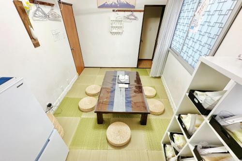 a small room with a table and two stools at Momo House Near Komagome easy to shinjuku, Ueno, Tokyo in Tokyo