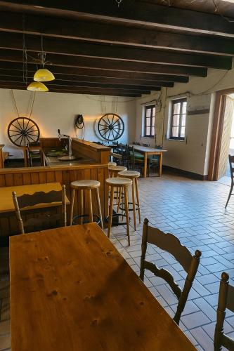 a room with a table and chairs and a kitchen at Partyraum Waldeslust Preis nach Anfrage in Oelde