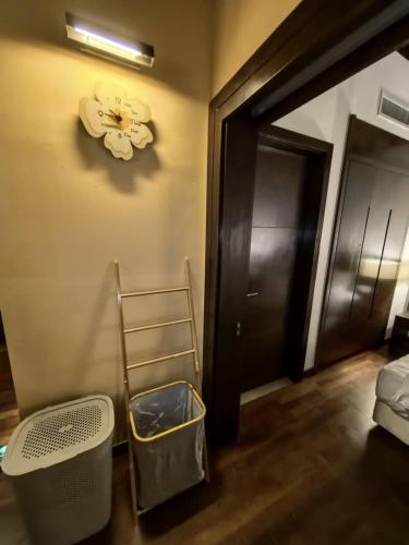 a room with a ladder and a door and a room with a bed at Goldcoast Palm Tree Sepang Luxury Resort in Sungai Pelik