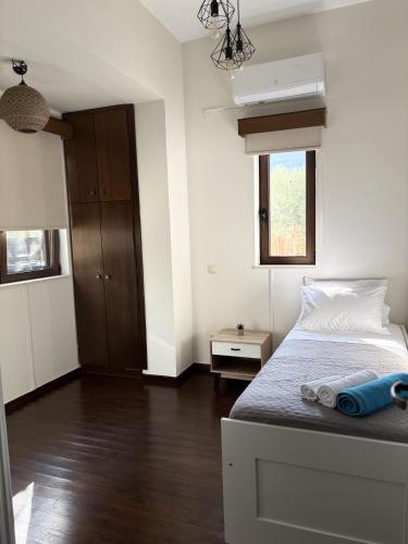 Ένα ή περισσότερα κρεβάτια σε δωμάτιο στο Papyrise Oliveside