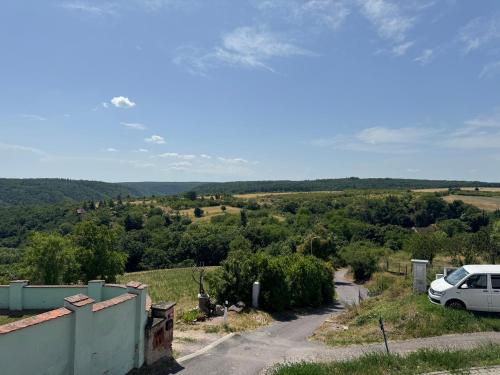 a white car parked on the side of a road at Apartmán za Humny in Znojmo