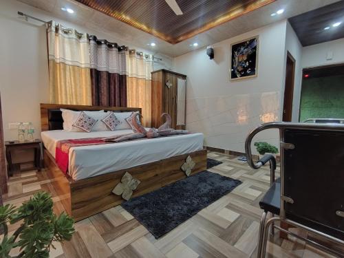 a bedroom with a bed in a room at A Greenwoods Hotel in Solan