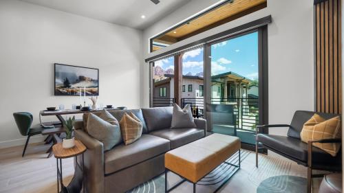 a living room with a couch and a table at Montclair at Zion in Springdale