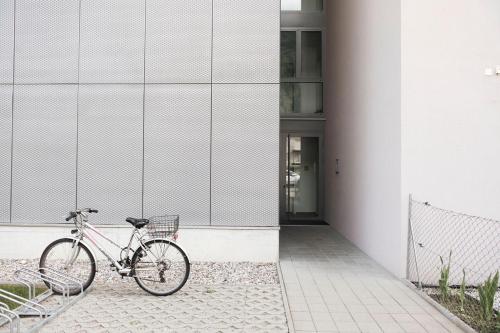 a bike parked in front of a building at Casa Solduno - App 1220 in Solduno