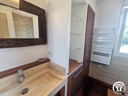 a bathroom with a sink and a mirror at La Pampa au Mas des Issarts in Saint-Jean-de-Fos