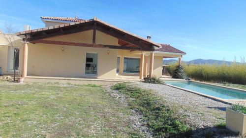 a small house with a swimming pool in front of it at La Pampa au Mas des Issarts in Saint-Jean-de-Fos