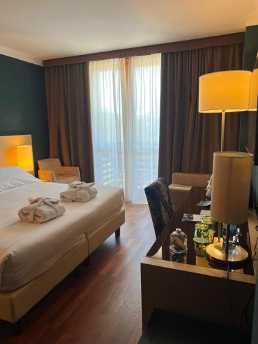 Katil atau katil-katil dalam bilik di Savoia Resort