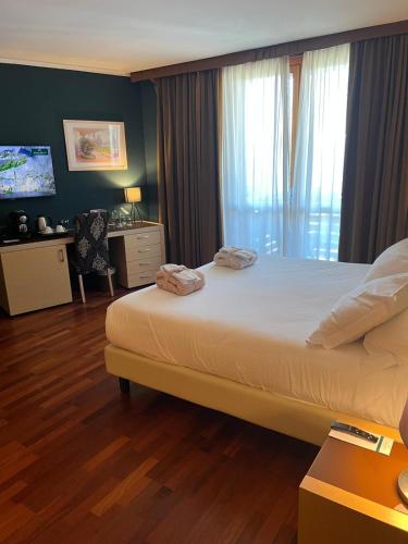 Katil atau katil-katil dalam bilik di Savoia Resort