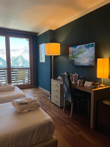 Katil atau katil-katil dalam bilik di Savoia Resort