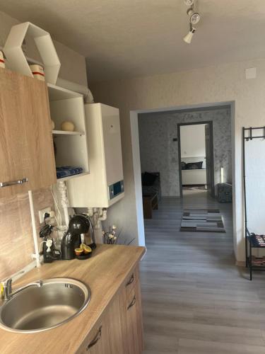 a kitchen with a sink and a counter top at Casa de vacanța in Brăila