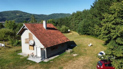 an aerial view of a white house with a red roof at Pine corner Mojkovac in Mojkovac
