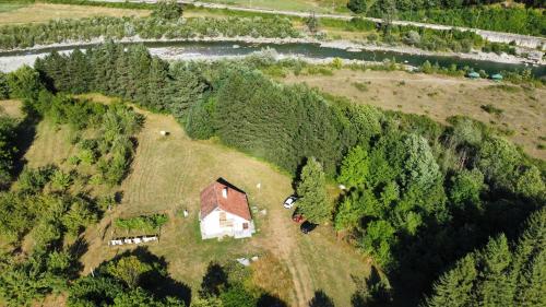 an aerial view of a house in the middle of a forest at Pine corner Mojkovac in Mojkovac