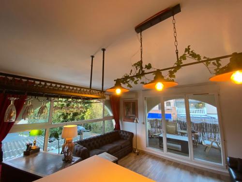 a living room with a couch and a table at Studio à Port Grimaud in Grimaud