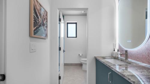 a bathroom with a sink and a mirror at Montclair at Zion in Springdale