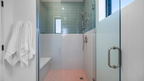 a bathroom with a shower with a glass door at Montclair at Zion in Springdale
