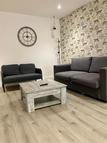 a living room with a couch and a coffee table at uniquejoe properties in Manchester