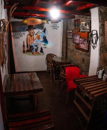 a room with tables and chairs in a restaurant at The Paulwood cabana home stay in Nuwara Eliya