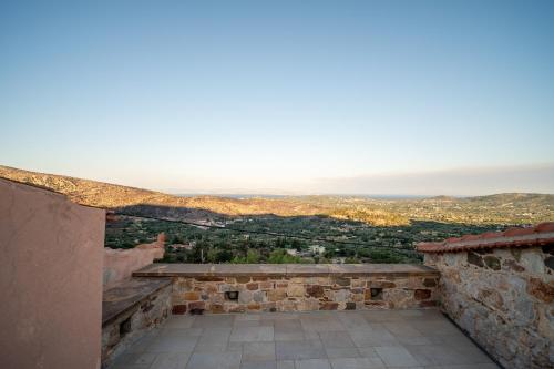 a view from the balcony of a house with a view at Aretis Stone Retreat 