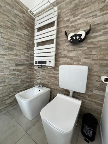 a bathroom with a toilet and a sink at Casa Adele in Grugliasco