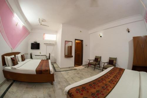Postel nebo postele na pokoji v ubytování Hotel Siddharth khajuraho