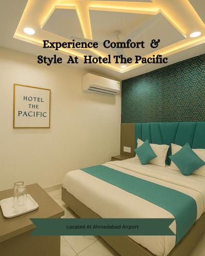 a hotel room with a bed and a sign at Hotel The Pacific in Ahmedabad