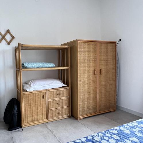 a room with a bunk bed and a wooden cabinet at Casa Adele in Grugliasco