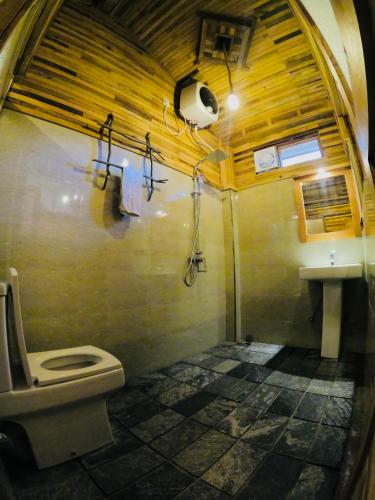a bathroom with a toilet and a sink at Secret Mountain Paradise in Ella