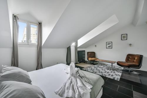 Ένα ή περισσότερα κρεβάτια σε δωμάτιο στο Hôtel Sauvage