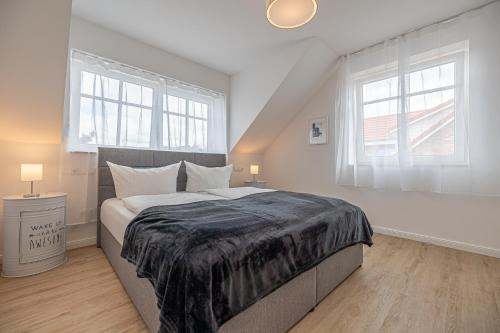 Ένα ή περισσότερα κρεβάτια σε δωμάτιο στο Haus Lee 54 Büsum