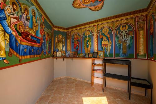 a room with religious paintings on the walls at AMAZING view, privacy and comfort - SPA Villa Krasi in Blagoevgrad