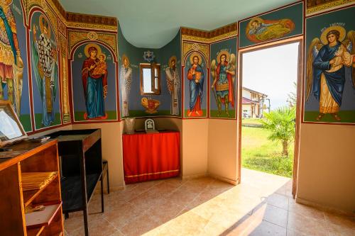 a room with paintings on the walls at AMAZING view, privacy and comfort - SPA Villa Krasi in Blagoevgrad