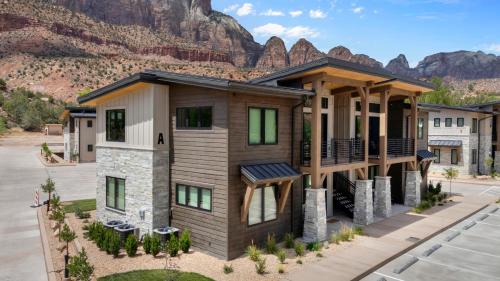 a house with a mountain in the background at Montclair at Zion in Springdale