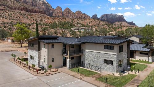 an aerial view of a house with mountains in the background at Montclair at Zion in Springdale