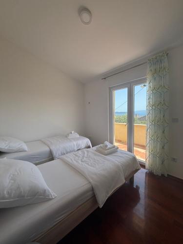 Ένα ή περισσότερα κρεβάτια σε δωμάτιο στο OliveTree Apartments