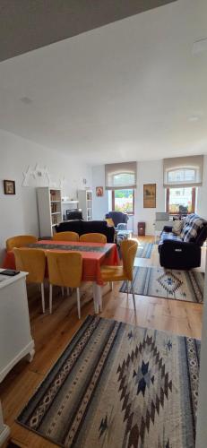 a living room with a table and chairs at Munich Residence in Cristian