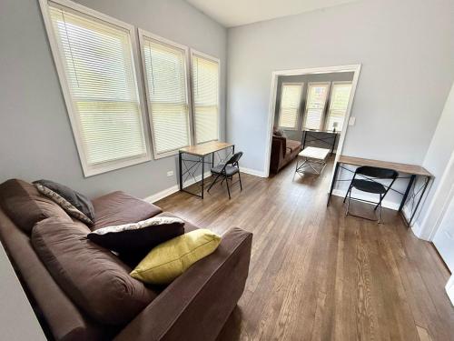 a living room with a couch and two windows at Amazing Place to stay near Downtown Chicago! in Chicago