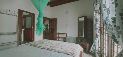 Postel nebo postele na pokoji v ubytování Wimalee resort