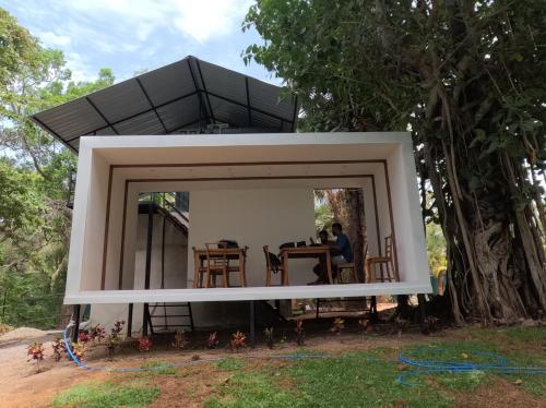 a mirror in front of a house at Leopard Inn Wilpattu in Ilavankulam