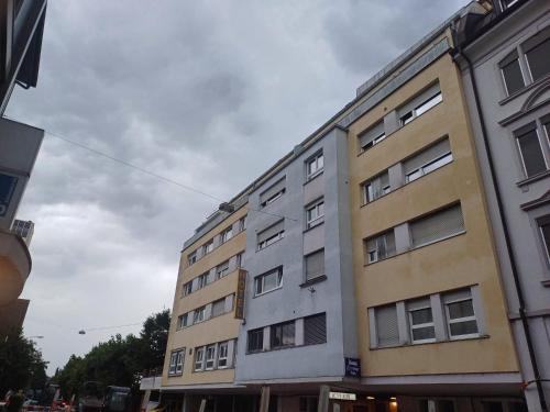 a tall building on the side of a street at Studio Marylin in Rorschach