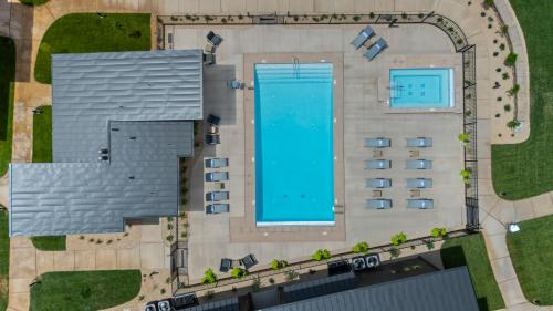 an overhead view of a building with a swimming pool at Montclair at Zion in Springdale