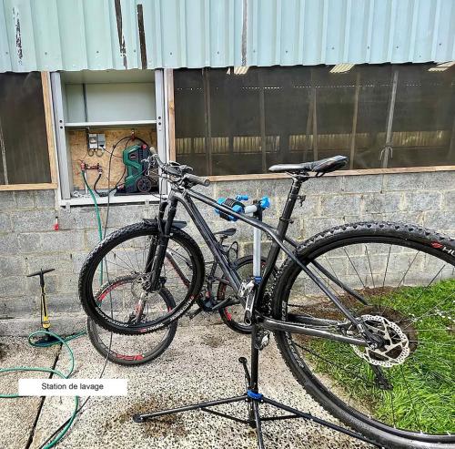 a bike parked in front of a building at Gîte Chez Cyrille in Houffalize