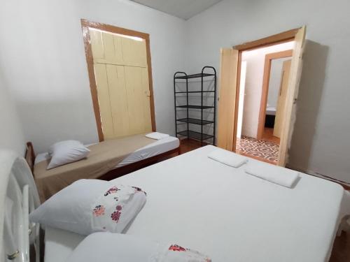 Ένα ή περισσότερα κρεβάτια σε δωμάτιο στο VILLA BOA Casa de Temporada