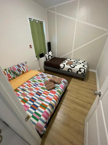 a bedroom with a bed with a quilt on it at Toronto Budget Central Stay in Toronto