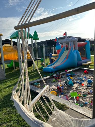 a playground with a bunch of play equipment at Silva in Rewal