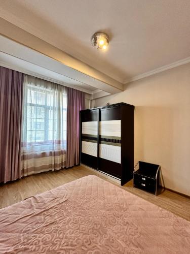 Llit o llits en una habitació de Triumf palase