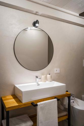 a bathroom with a sink and a mirror on the wall at Loft di design Wi-Fi e Clima in Porto SantʼElpidio